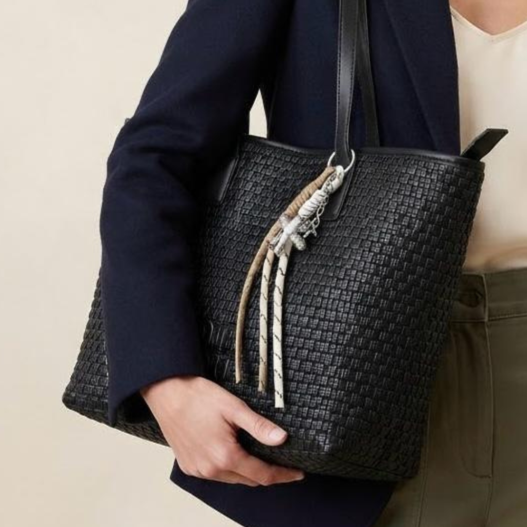Tote Bag featuring a textured in Black
